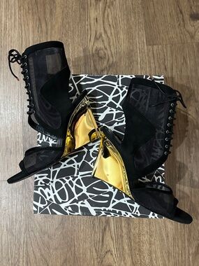 Diane Von Furstenberg Black and Gold Lace Up Statement Ankle Booties